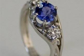 platinum engagement ring with blue sapphire and diamonds