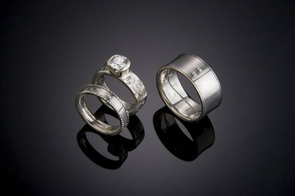 Both Jerry and Heather's rings are made of Titanium and 14k white Gold