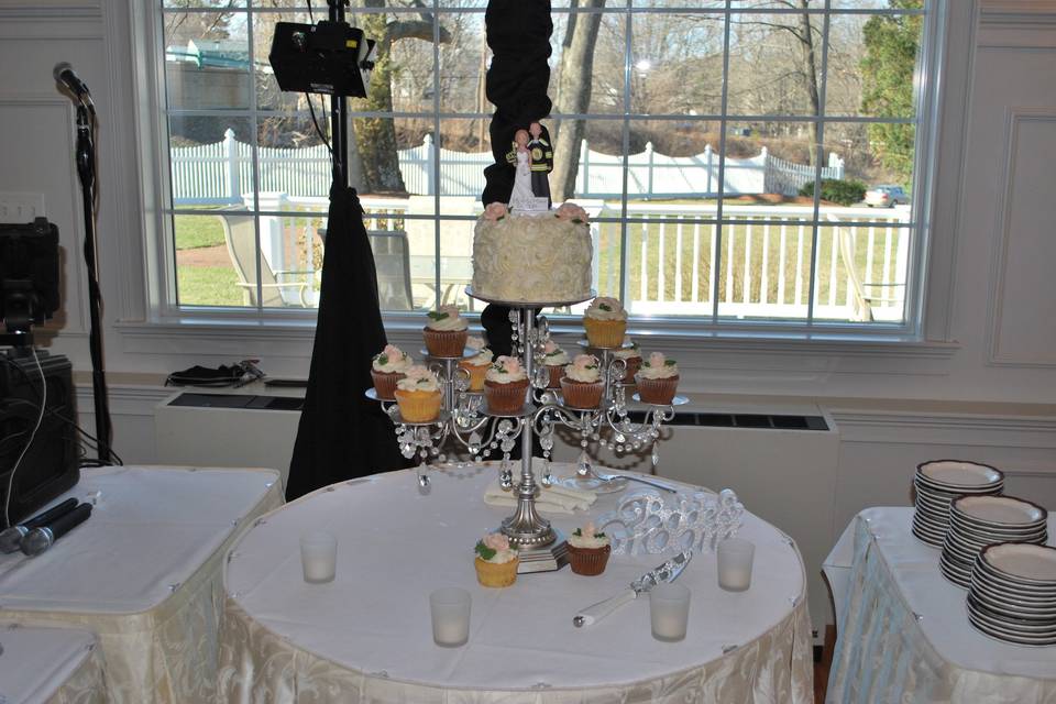 Wedding cake and cupcakes area