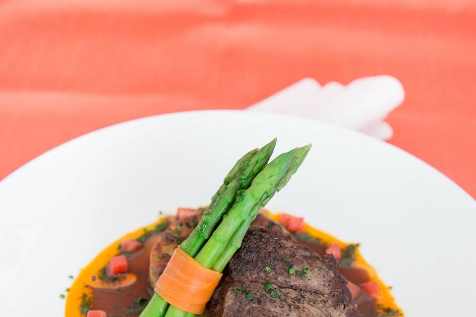 Filet of beefwith a red wine demi-glace with potato gratin and asparagus with carrot ribbon