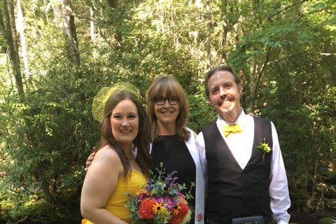 Posing with the wedding officiant