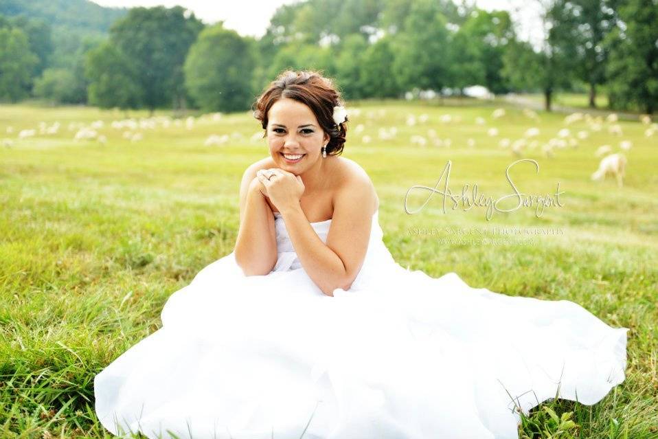 Bride sitting on the grass