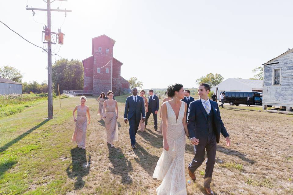 Bridal part walking by barn