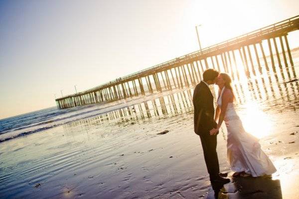 Couple kissing at sunset