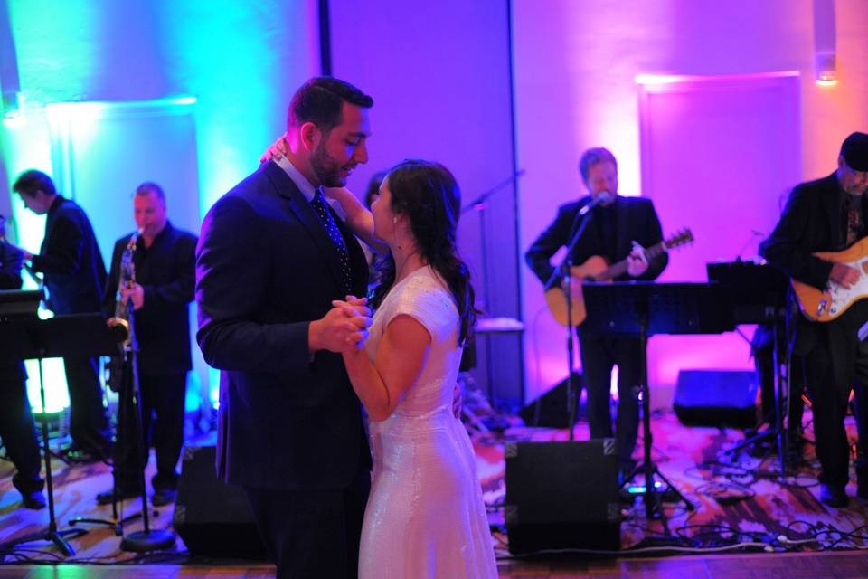 Couple dancing in blue and purple lighting