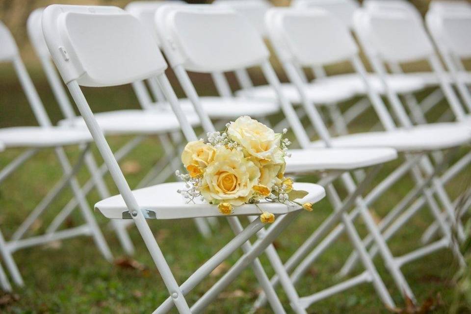 Wedding ceremony chair with bouquet