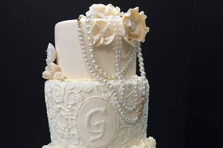 Four tier wedding cake with edible pearls