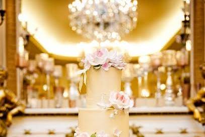 Four tier wedding cake with pink flowers