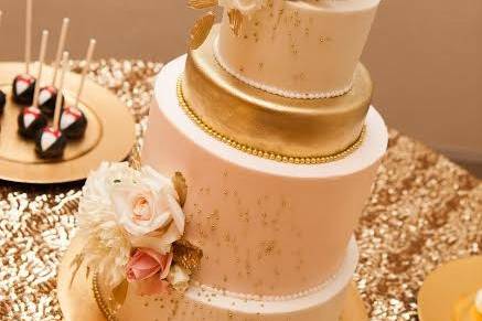 Four tier wedding cake with pink flowers