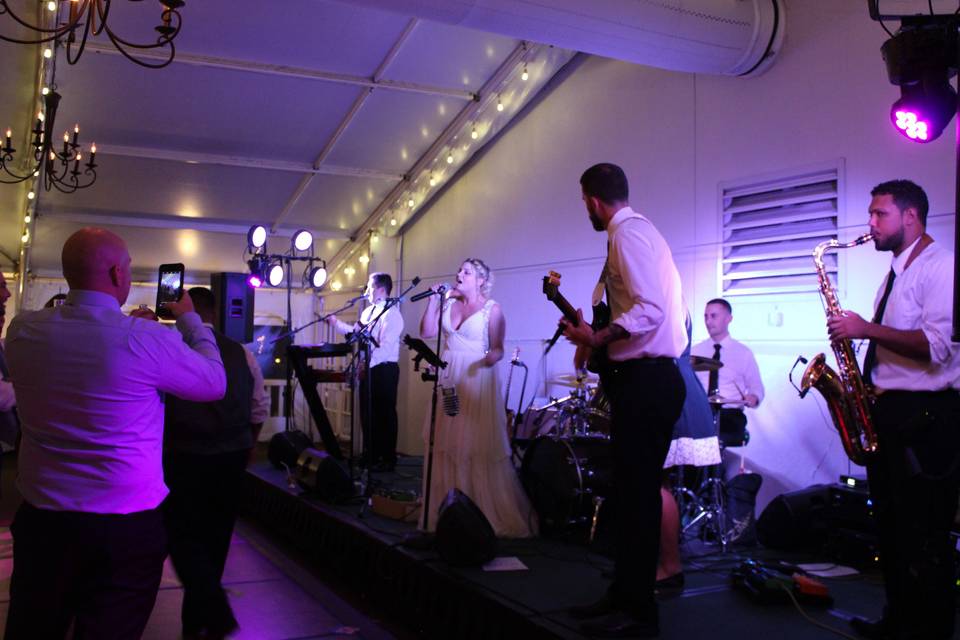 Bride singing with the band