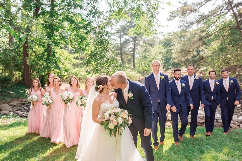 The couple with the bridesmaids and groomsmen