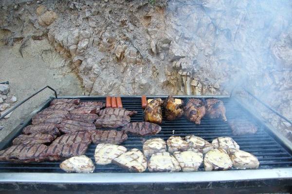 Ribeye Steaks & Swordfish cooked over Mesquite charcoal.