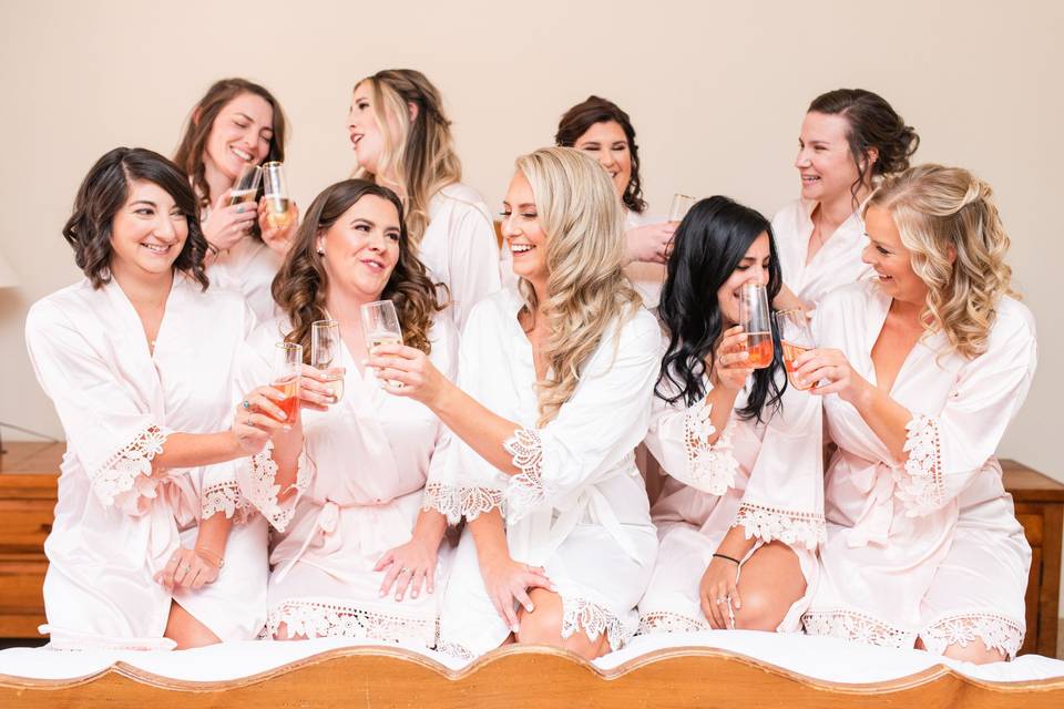 Bride toasting with bridesmaid