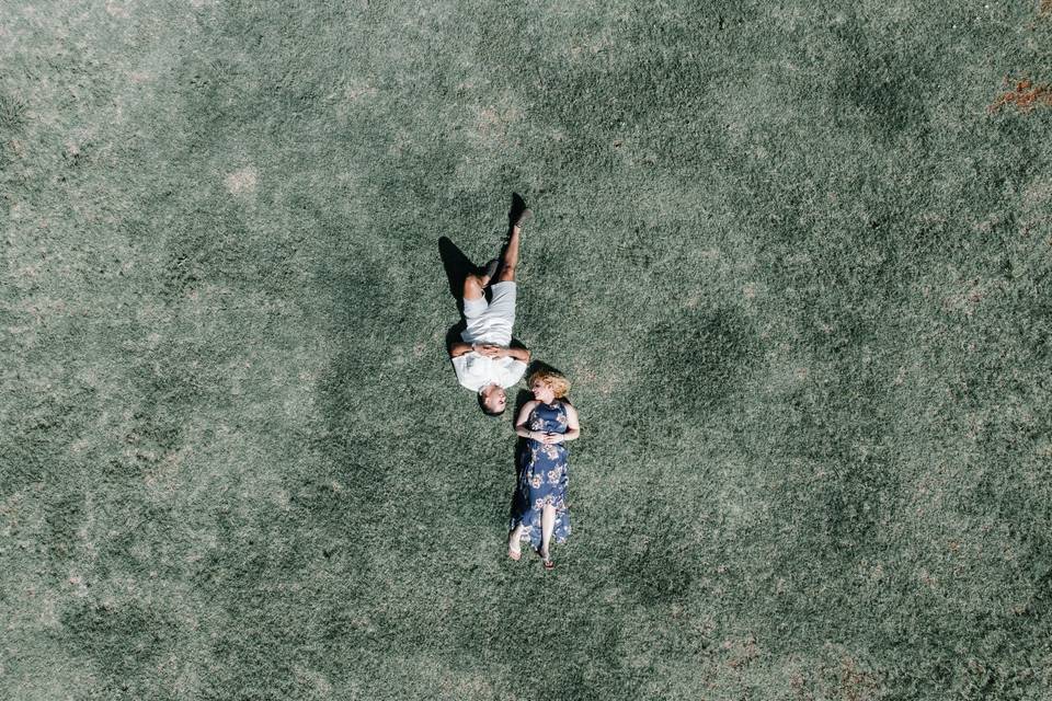 Couple laying on the grass