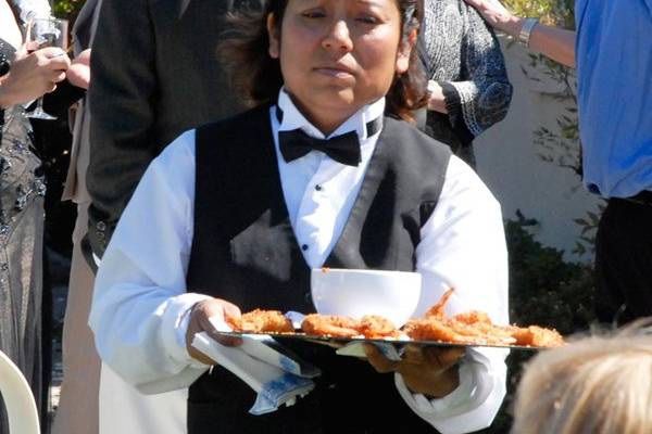 Passing food for guests
