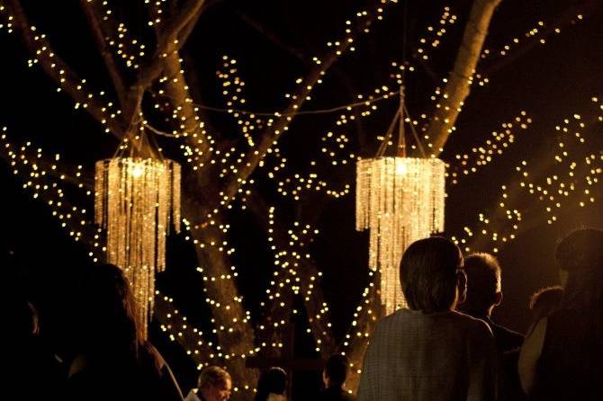 Nighttime ceremony with chandeliers