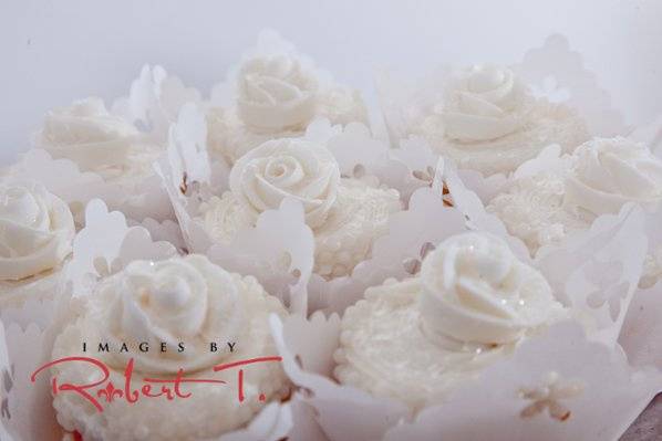 A white cupcake wedding.Several flavors of cupcakes available including red velvet, carrot cake, etc.