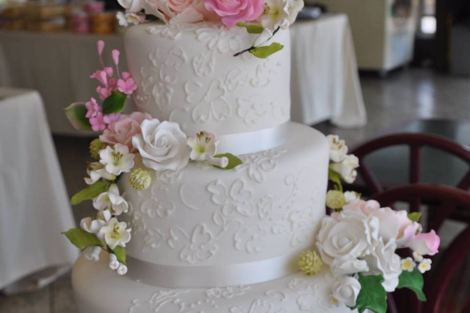 3 layered with white rose decor cake