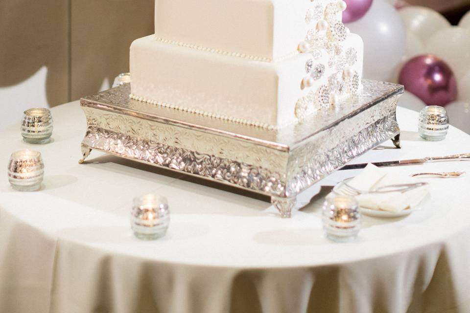Broach adorned wedding cake