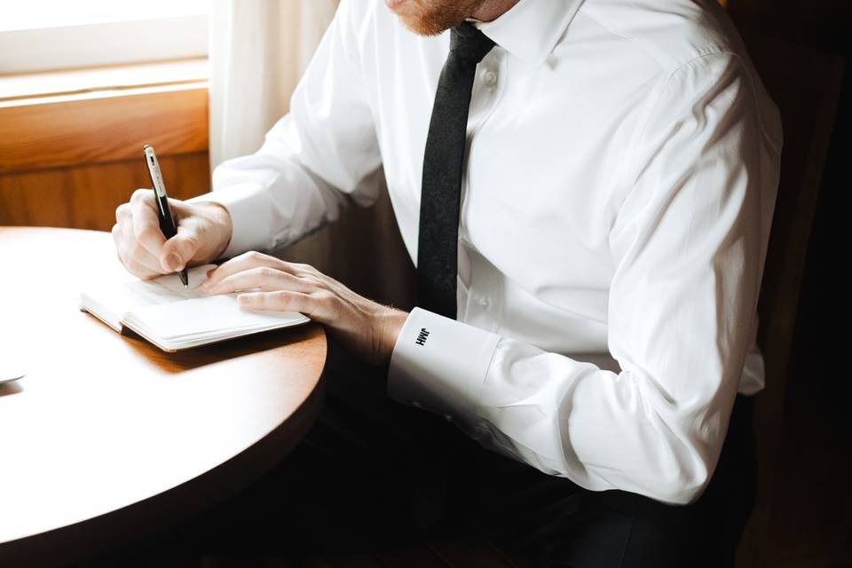 Groom writing vows