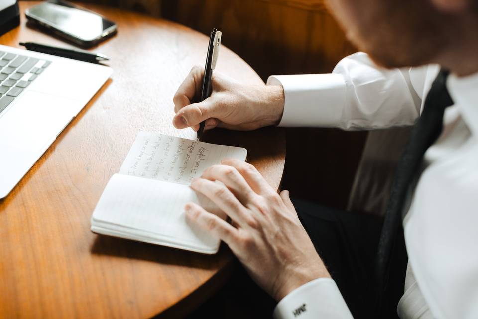 Groom writing vows