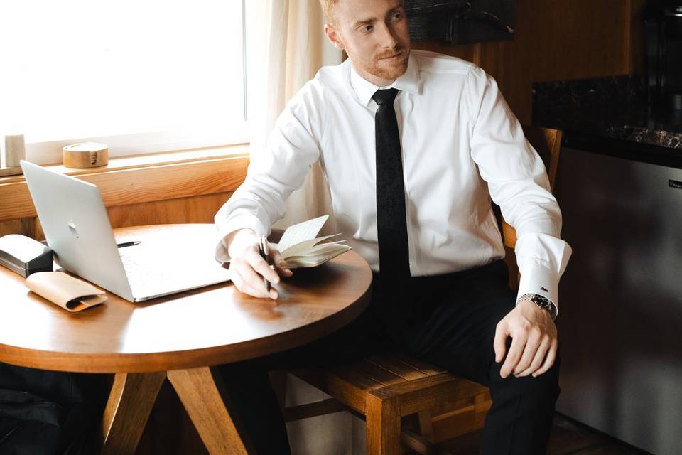 Groom writing vows