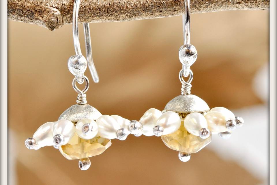 Daisy Earrings in White Pearl and Citrine - Delicate yellow centers of faceted citrine surrounded by luminous white pearl petals, accented by sterling silver tips with a hand-formed frosted sterling silver cap and sterling silver French ear wires.