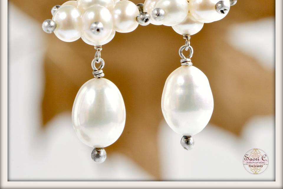 Divinity Earrings in White Pearl - Clusters of delicate white pearls accented by beautiful oval white pearl pendants, suspended from elegant sterling silver French ear wires.