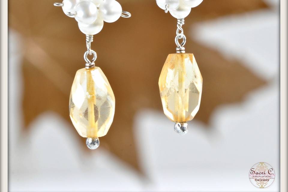 Garden Mist Earrings in Citrine and White Pearl - Softly glowing honey gold pendants of faceted citrine suspended from a delicate cluster of lustrous white pearls, dangling from sterling silver French ear wires.