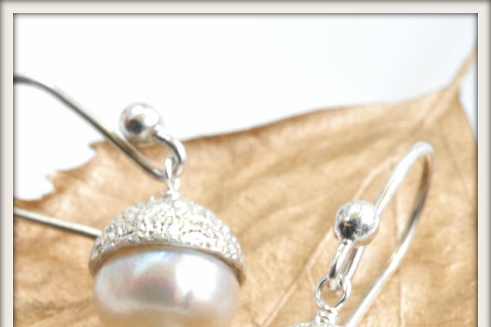 Starlet Earrings in White Pearl and Aquamarine - Large lustrous white pearls and tiny faceted aquamarine accented with a gracefully sparkling hand-formed sterling silver pavé cap, suspended from sterling silver French ear wires.