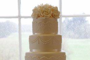 5 tier fondant ivory cake with sugar rose flowers