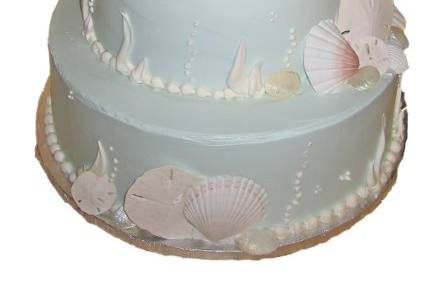 3 tiered beach themed cake with custom shells