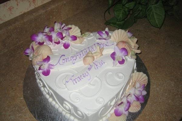 Heart shaped engagement cake with orchids