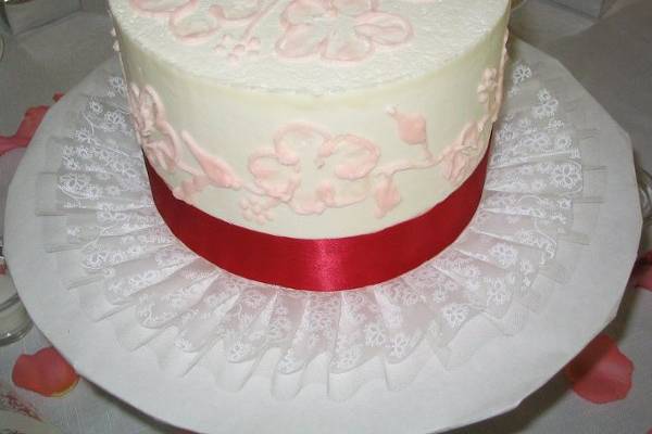 Pink brush embroidery flowers and a Ribbon design. This individual cake served as a centerpiece and dessert.
