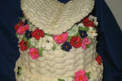 Flowers were the theme for this bride, she wanted lots of colorful flowers spilling out of a basket cake