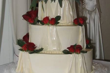 Wedding Drapes, a three tiered cake iced and draped with fondant accents.