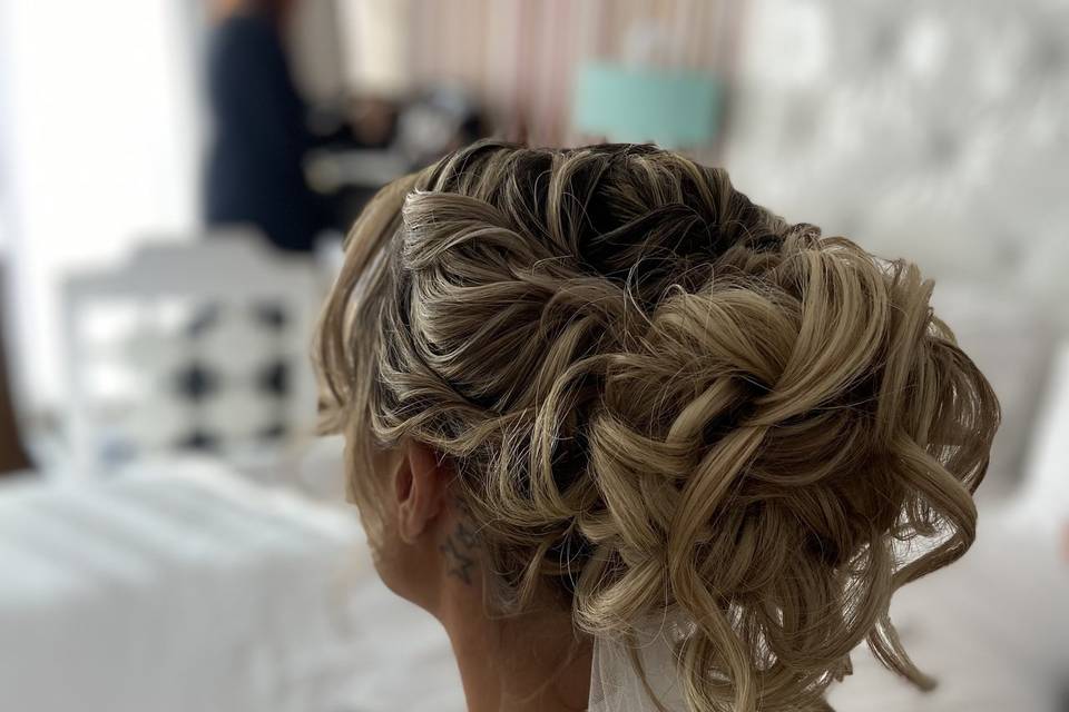 Soft, romantic , high Updo