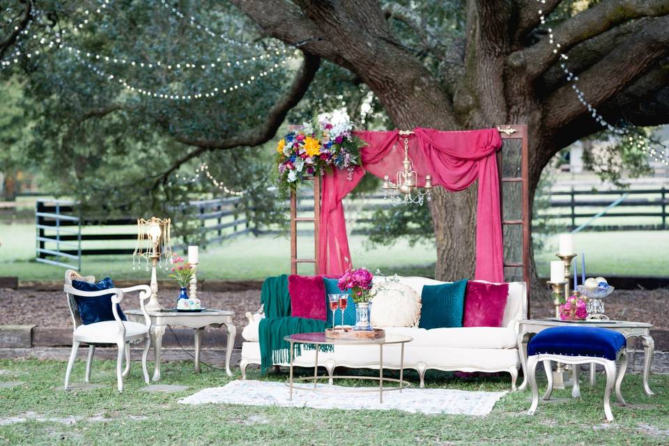 Intimate toasting lounge under a large tree