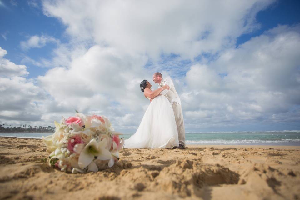 Beach, sun, and happy couple