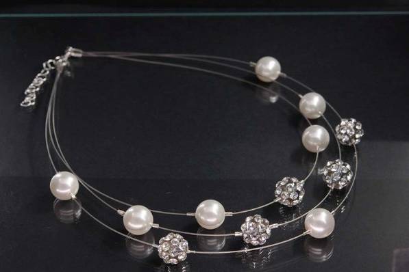 Swarovski Crystals and Pearls float on 3 strands of invisable wire