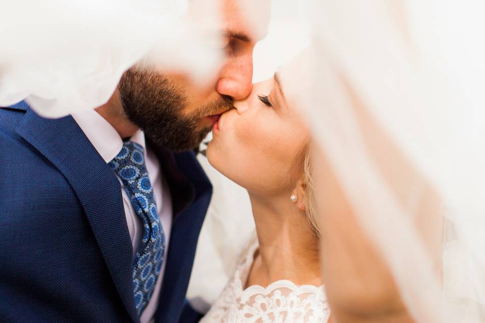 Newlyweds kissing