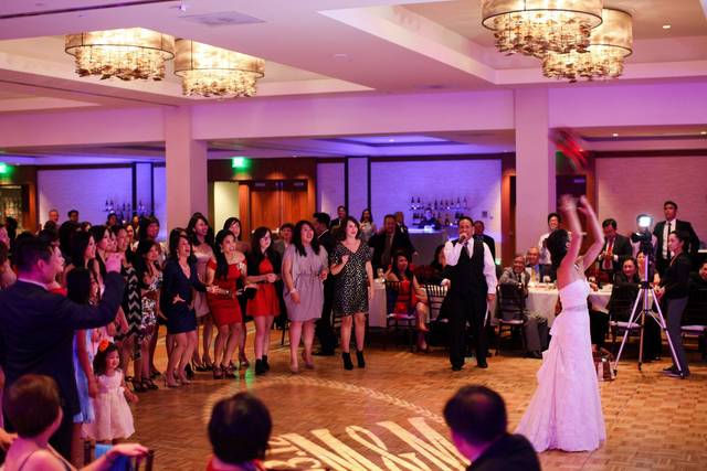 The bride throwing her bouquet
