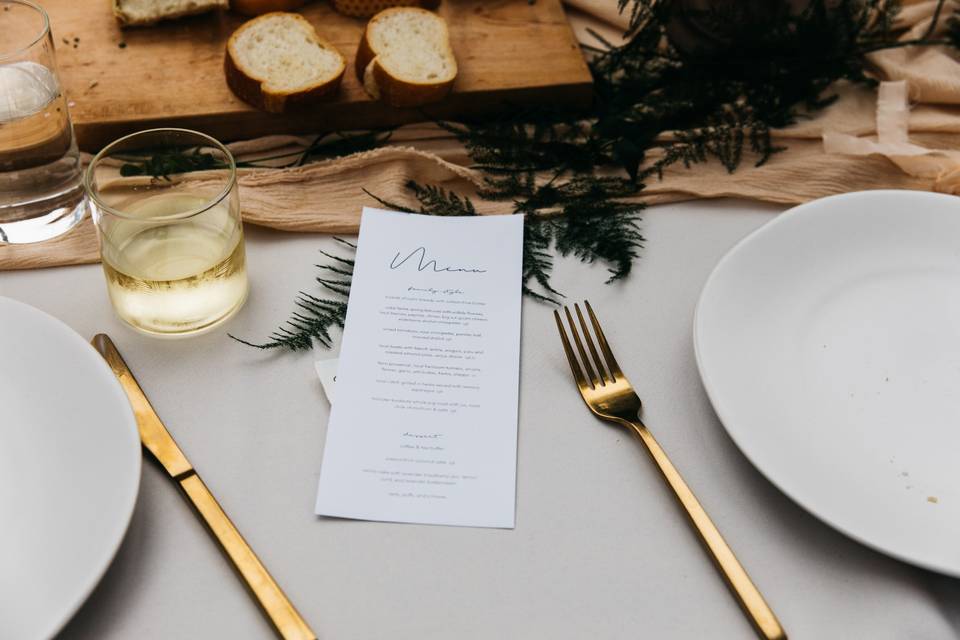Place setting with gold cutlery