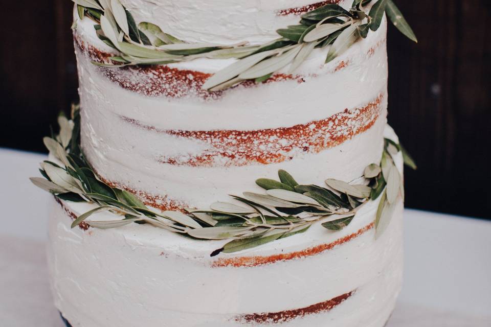 Semi-naked cake with white flowers