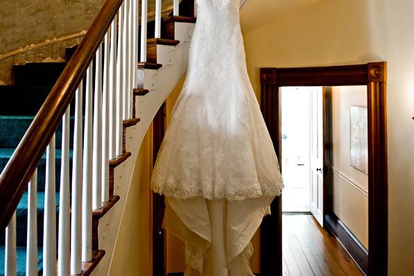 Wedding gown hanging on the staircase