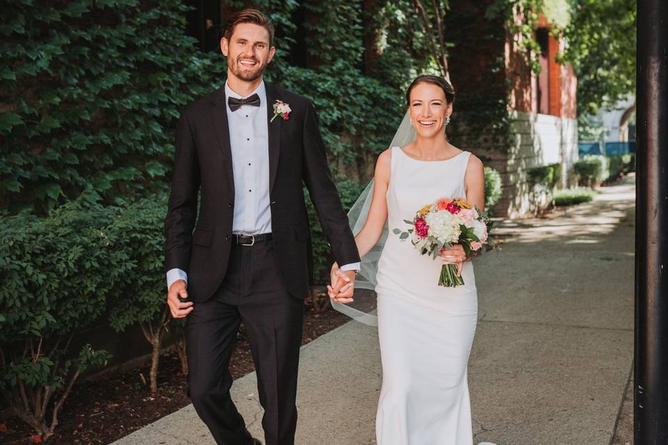 Happy bride and groom walking