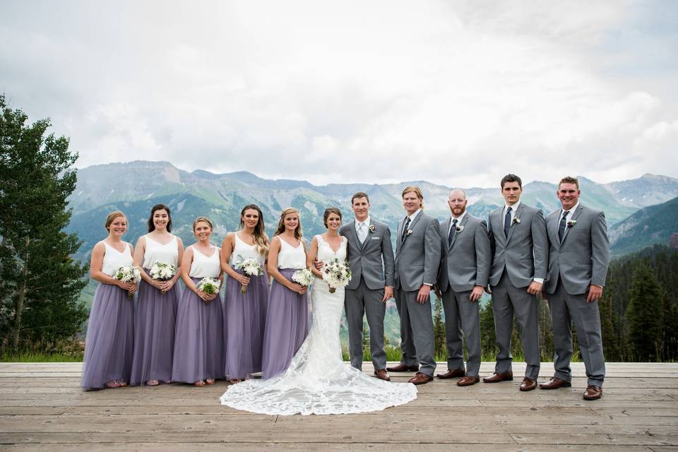 The couple with the bridesmaids and groomsmen