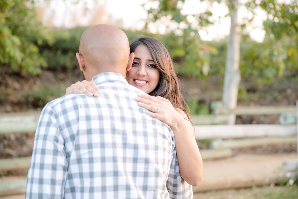 Bride showing her wedding ring in naturalistic trails of Brea, Orange County.