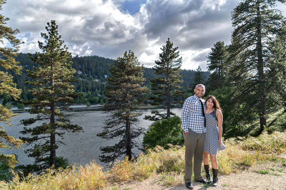 Dramatic clouds, pine trees and rippled waves complete this photo session