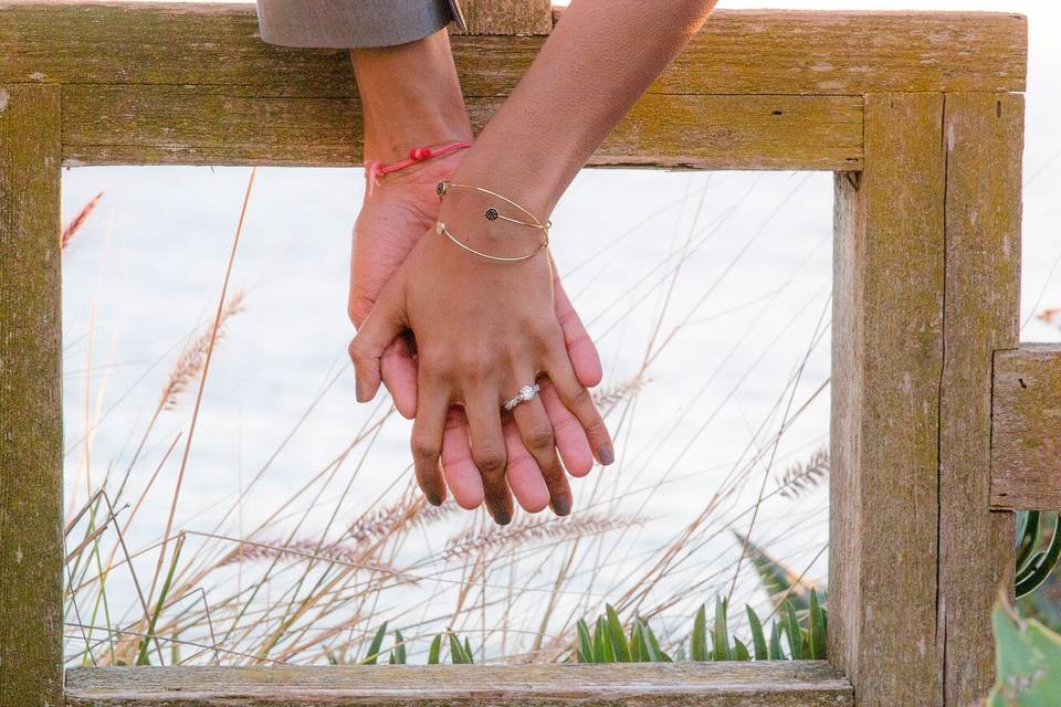 Wedding ring on full display as the lovely couple lock hands